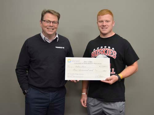 FRS Scholarship winner check presented by John Nelson. 