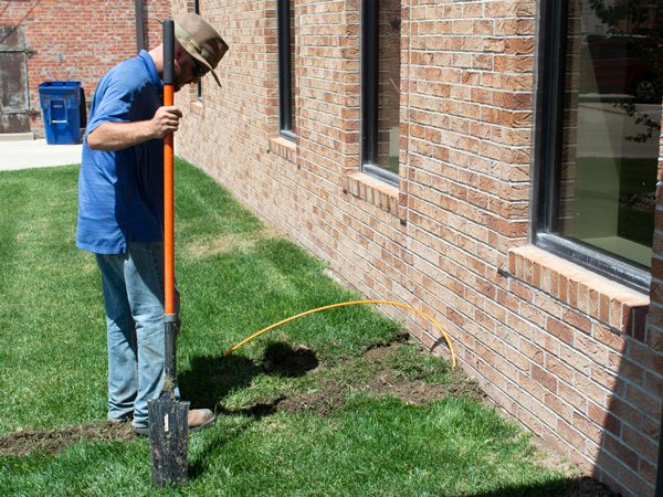 Bury fiber optic cable in lawn.